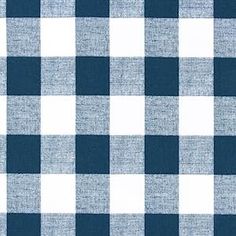 a blue and white checkered fabric with a ruler in front of the plaid pattern