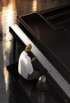 a man sitting on the ground next to a piano