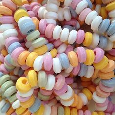 many different colored beads are stacked on top of each other