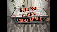 a table with the words spring clean challenge written on it in front of a curtained window