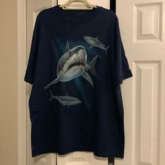 Never Worn Great White Shark Shirt From Cape May, Nj! Deep Navy Blue Color. Label And Size Tag Cut Out But Looks Like Xxl. Small White Stain On Bottom/Back Of Shirt (See Last Photo) That Should Likely Come Out In The Wash. Make An Offer! Smoke And Pet Free Home. Shark Tee, Cape May Nj, Shark Shirt, Marvel Shirt, Deep Navy Blue, Blue Shark, White Stain, White Sharks, Concert Shirts