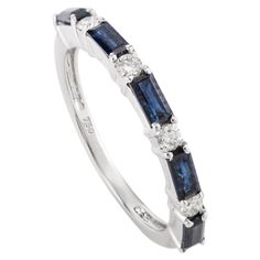 a white gold ring with blue sapphire and diamonds