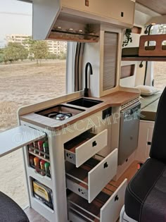 an rv kitchen is shown with the sink and stove in it's center section