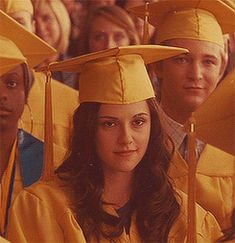 a group of people in graduation caps and gowns