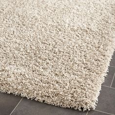 a white rug is laying on the floor