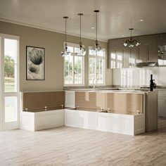 an empty kitchen with white cabinets and wood flooring is pictured in this image from the inside