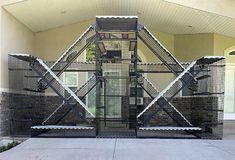 a large metal structure sitting in front of a building