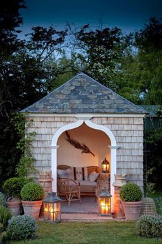 an outdoor living area is lit up at night