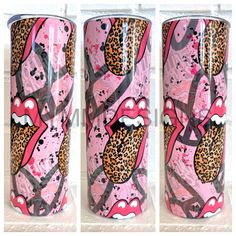 three pink and black cups with leopard print on them