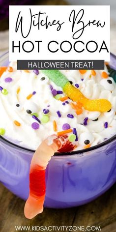 a purple bowl filled with halloween treats and the words witches brew hot cocoa on top