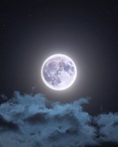 the full moon is shining brightly in the night sky with clouds and stars around it