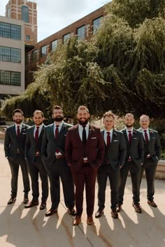 a group of men in suits standing next to each other