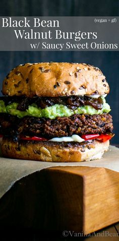 a hamburger sitting on top of a wooden cutting board