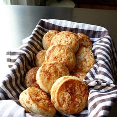 a basket full of biscuits sitting on top of a table