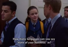 two men and a woman standing in front of a door with the caption how many languages can you say none of your business?