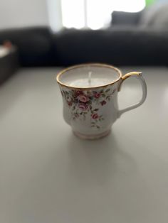 a coffee cup sitting on top of a table