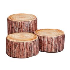 three wooden stools stacked on top of each other in the shape of trees trunks