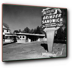 a black and white photo of a sign for a sandwich restaurant in the 1950's