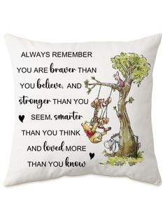 a white pillow with winnie the pooh quote and an image of a tree on it