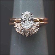 an engagement ring with three stones on it