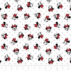 mickey and minnie mouses on white polka dot fabric