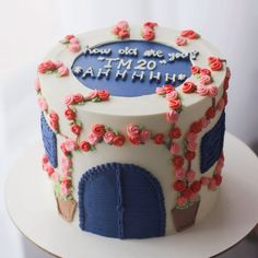 a birthday cake decorated with roses and frosting