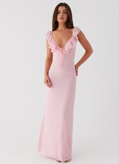 Peppermayo Exclusive Elevate your evening look with the Silvie Maxi Dress. Featuring a V neckline, frill straps, and delicate frill detailing at the neckline. Embrace the magic of balmy nights and shimmering silhouettes.       - Maxi length- V neckline- Frill straps and neckline detail- Open back- Adjustable straps- Ti Pink Revolve Dress, Rehearsal Dinner Dress Pink, Pink Banquet Dresses, Formal White Maxi Dress, Deb Ball Guest Dresses, Pretty Pink Dresses Classy, Pink Maxi Dress Aesthetic, Revolve Dress Long, Frilly Bridesmaid Dress