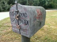 a mailbox that has been decorated with graffiti