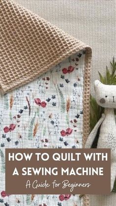 a teddy bear sitting on top of a quilt with the words how to quilt with a sewing machine