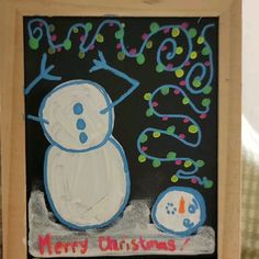 a chalk board with a snowman on it