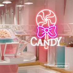 a candy store window with the word candy on it's side and an image of a pink neon sign that says candy