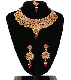 "Elegant gold Choker Necklace Set | Traditional jewelry decorated with AD CZ and synthetic ruby stones magnificent design Necklace Set | Indian Jewelry Set | comes with matching earrings and mang tikka | 1 x Necklace approx. 4.5 inches Collar-Wide . Back adjustable rope is attached. 1 x Pair of Earrings 2.8\" Length from top to bottom. *Adjustable & Appropriate for All Neck Sizes. Perfect for a bride in wedding or party wear jewelry set." Luxury Dual-tone Necklaces For Diwali, Gold Choker Necklace Set, Cz Stone Necklace, Indian Jewelry Set, Mang Tikka, American Diamond Necklaces, Real Queens, Necklace Collar, Wear Necklaces