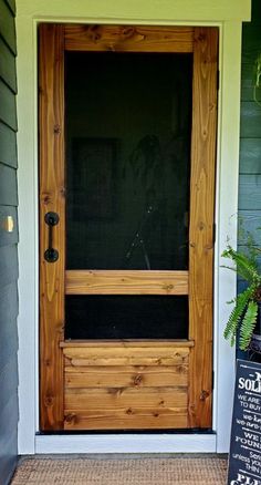 the front door to a house with a sign on it