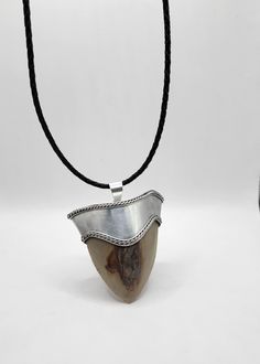 Megalodon tooth pendant!  These pendants are made with REAL fossil megalodon teeth! The pendant is hand-made to fit the top of each tooth! These are designed to be light enough to be worn around the neck or simply hang them as decor. Great for kids to wear and show off! Great gift idea!! Very cool and nostalgic! Tooth Pendant, Megalodon Tooth, Shades Of Turquoise, Oklahoma City, Turquoise Color, Fashion Jewelry Necklaces, Electronic Items, Oklahoma, Fashion Watches