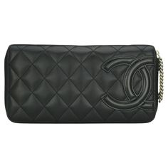 CHANEL Quilted Cambon Long Zipped Wallet Black Calfskin with Silver-Tone Hardware 2012. This stunning large zipped wallet is in good condition. It still holds its original shape, and the hardware is still very shiny. It is such a gorgeous, functional long wallet that it can also be used as a clutch. - Exterior Condition: Good condition, corners show light leather surface wear. The exterior of the wallet shows light fingernail scratches. The patent CC logo shows edges wear. - Interior Condition: Luxury Quilted Chic Wallet On Chain, Best Wallet, Pull Chain, Chanel Wallet, Interior Fabric, Zip Wallet, Cc Logo, Small Accessories, Long Wallet