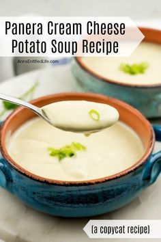 two bowls filled with cream cheese soup on top of a table