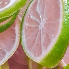 some limes are cut in half and placed on top of each other