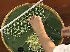 a person is working on a weaving project