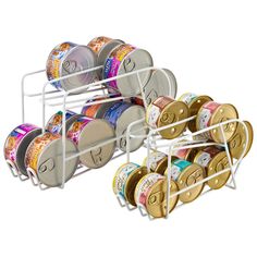 a stack of reels and spools in a metal holder on a white background