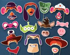 a bunch of masks that are on sticks