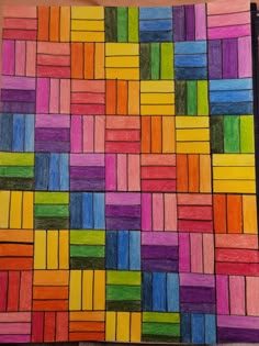 colored pencils are arranged in the shape of a mosaic pattern on a piece of paper