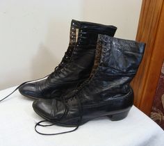 These women's high top, lace up shoes are in nice early 1900's antique condition.  There is a label inside reading:  Trademark Genesee, Wm. Eastwood & Son, Rochester, Buffalo.  On the opposite side it has printed:  7 1/2 C (I'm assuming size), 403347 T, 121. The black lightweight leather is still pretty supple.  There are scuffs here and there mostly at the toe and heel.  All the small lacing grommets are there as are the laces.  I'm not sure if they are original but they look and feel like they Vintage Formal Boots With Laces, Vintage Lace-up Boots For Formal Occasions, Vintage High-top Boots, Vintage Lace-up Boots, Vintage Lace-up Boots With Leather Sole For Formal Occasions, Vintage High-top Lace-up Boots With Leather Sole, Vintage Black High-top Lace-up Boots, Vintage Lace-up Cap Toe Boots With Leather Sole, Vintage Lace-up Boots With Cap Toe And Leather Sole