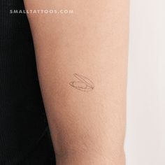 a woman's arm with a small tattoo on the left side of her arm