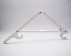 a white triangle shaped shelf bracket on a white background