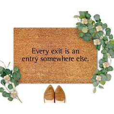 a door mat with the words every exit is an only somewhere else on it next to a pair of shoes