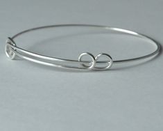 Sterling silver expandable bangle SIZE: width: 2.5 inch to 3.25 inch You will receive one sterling silver expandable bracelet. It's .925 sterling silver. Please contact me if you need a different quantity. Thanks for looking! Adjustable Sterling Silver Round Bangle, Adjustable Sterling Silver Bracelet For Friendship, Silver Sliding Knot Bangle Bracelets, Adjustable Sterling Silver Charm Bracelet With Extender, Silver Sliding Knot Bangle Bracelet, Silver Adjustable Band Bracelet As Gift, Silver Adjustable Band Bracelet For Gift, Silver Bangle Bracelet With Sliding Knot, Silver Nickel-free Bangle For Friendship