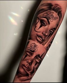 a woman's arm with two faces and words on the face, in black and white