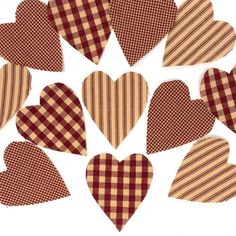 many hearts are arranged together in the shape of checkered heart shaped paper pieces on a white background