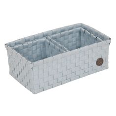 a white basket with two compartments on it