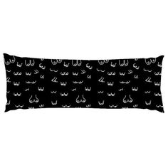 a black and white rectangular pillow with cats'heads printed on the front, along with two sides